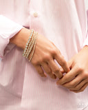 Paparazzi Persistent Pizzazz - Gold