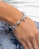 Paparazzi Coquette Caliber - White